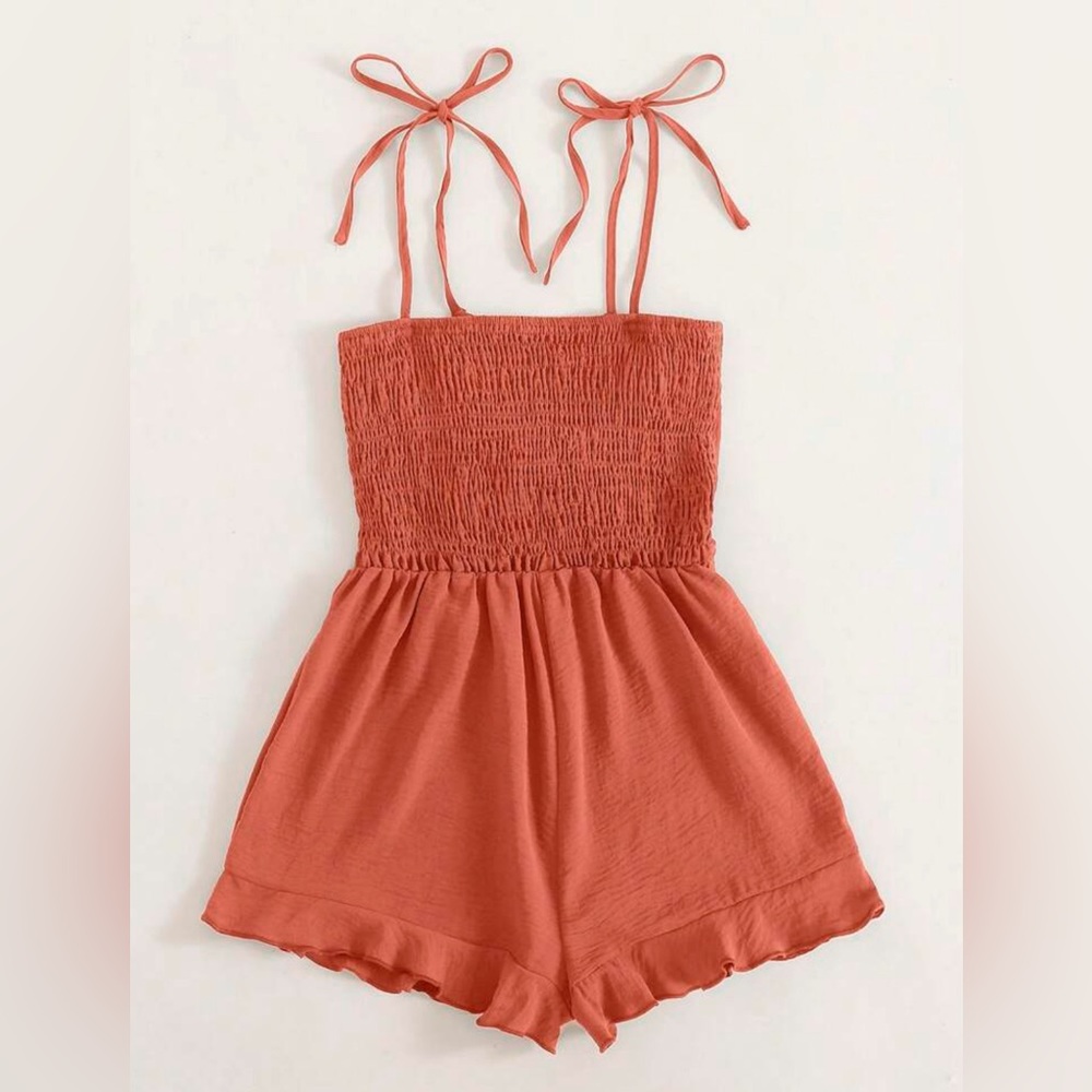 Coral romper in sizes XS to XL